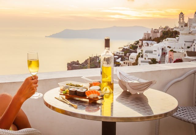 Table on balcony overlooking bay.