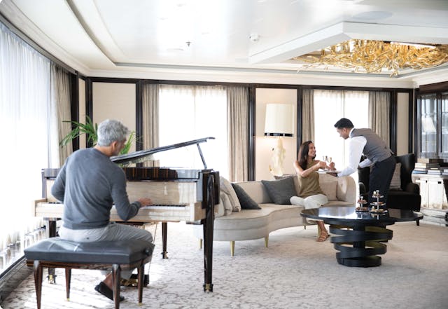 Cruise ship cabin interior with piano and sofa