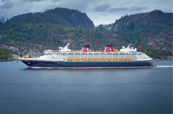 Cruise ship with mountains in background