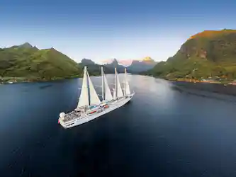 Cruise ship with mountains in background