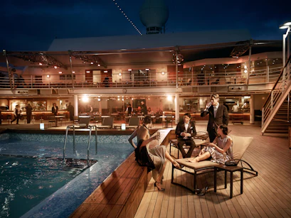 guests on pool deck at night on Silver Muse