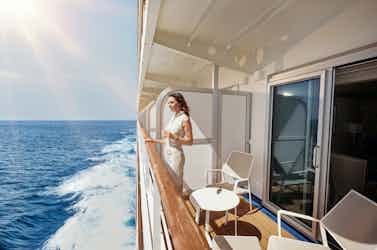 Woman standing on veranda on Silversea ship