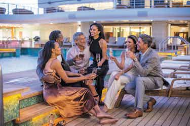 Three couples on deck of Regent Seven Seas Explorer
