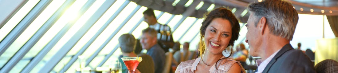 couple in horizons bar on oceania ship