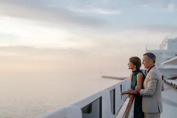 couple on regent vacation overlooking ocean