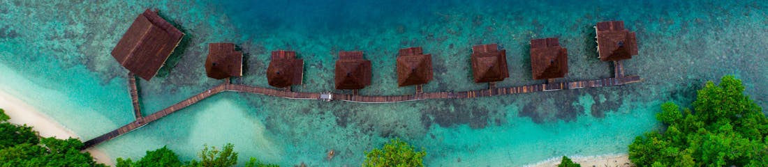 overwater bungalows in maluku, indonesia