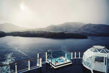 people in hot tub on deck of lindblad ship in patagonia