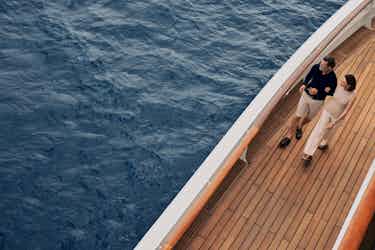 couple on deck of crystal ship