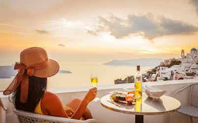 woman looking at view in santorini, greece