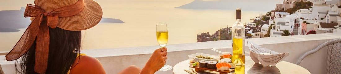 woman looking at view in santorini, greece