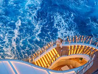 couple on stairs of silver ray ship - silversea