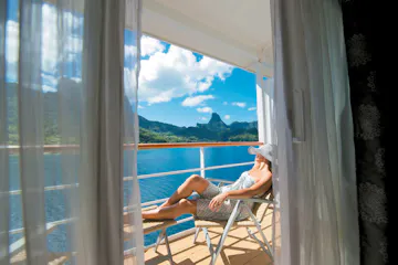 woman on balcony of paul gauguin ship