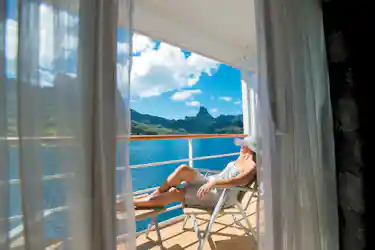 woman on balcony of paul gauguin ship