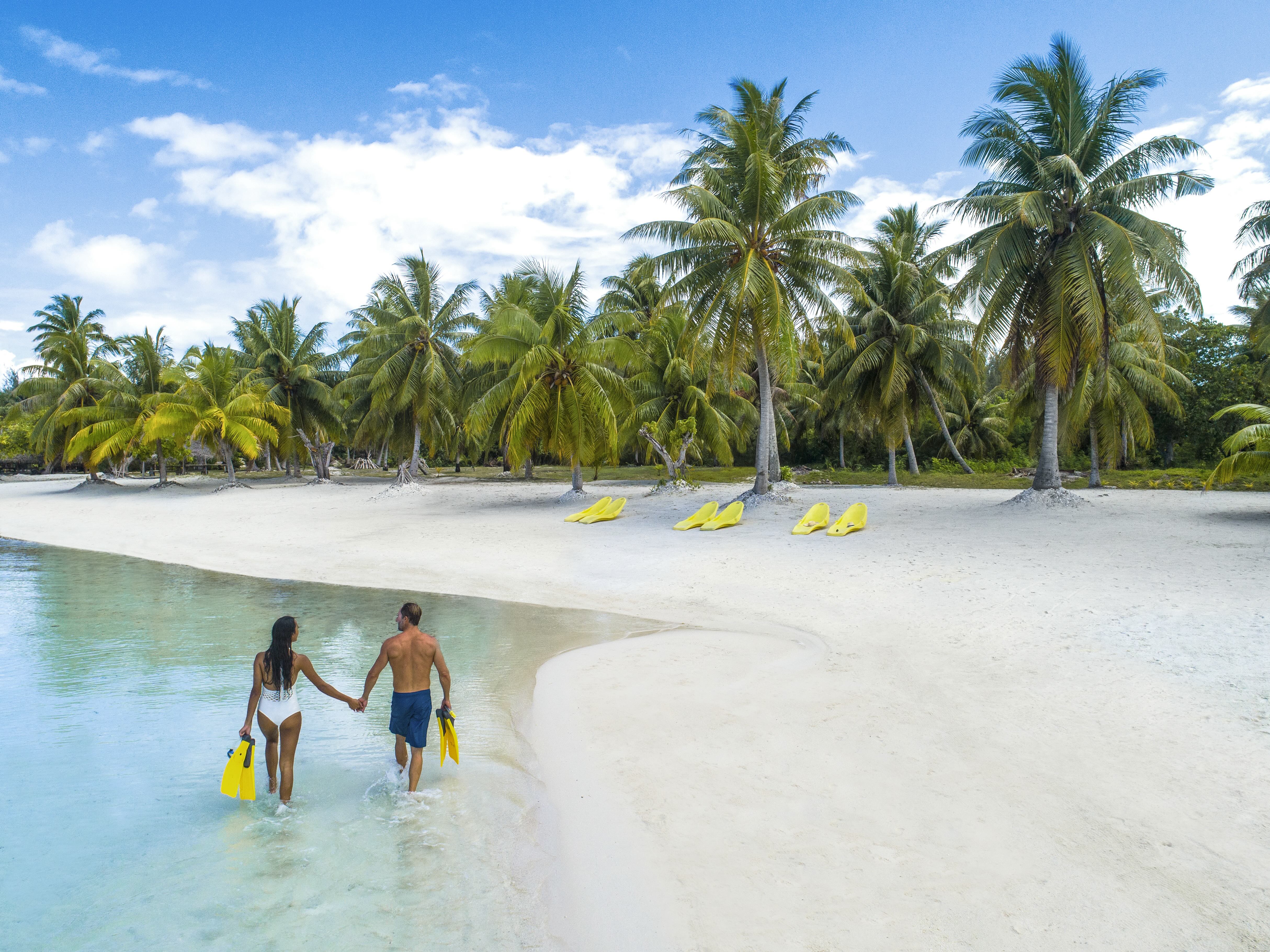 couple on private beach in bora bora