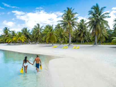 couple on private beach in bora bora