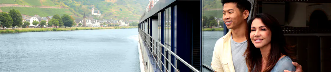 couple on balcony of amawaterways river ship