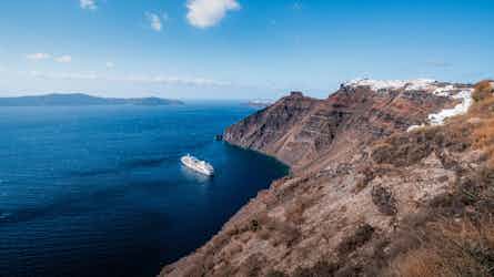 silversea ship sailing off the coast of santorini, greece