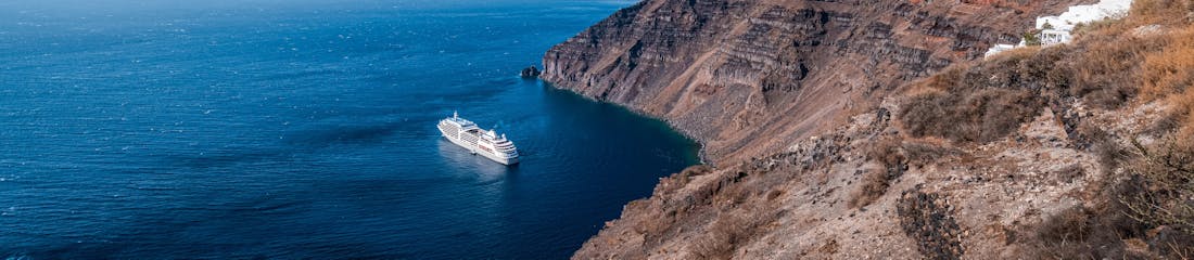 silversea ship sailing off the coast of santorini, greece