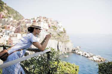 woman overlooking cinque terre, italy