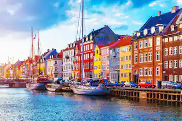 Colorful waterfront row houses and sailboats along Nyhavn canal, Copenhagen