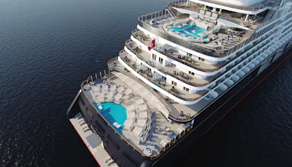 Overhead view of a cruise ship stern with tiered decks, pools, balconies, loungers and ocean
