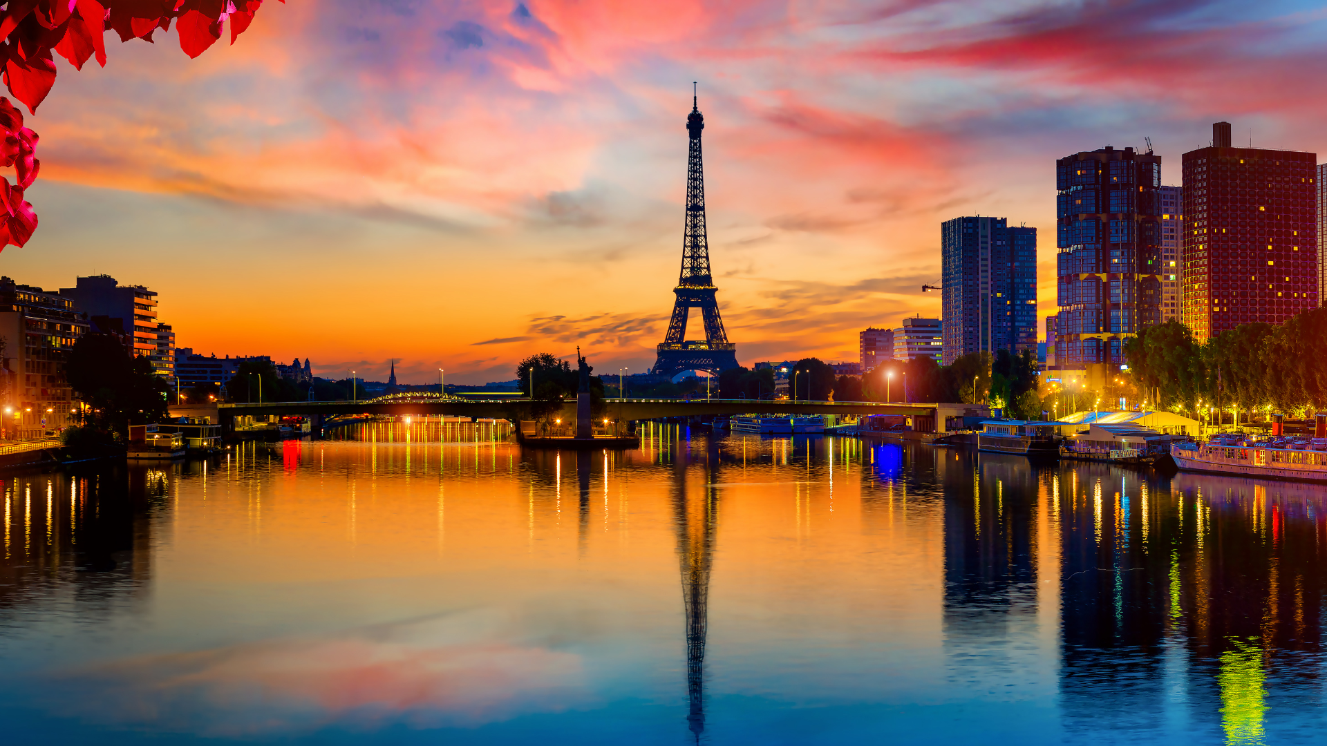 Eiffel Tower at colorful sunset over the Seine, reflections, bridges, boats, red leaves