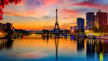 Eiffel Tower at colorful sunset over the Seine, reflections, bridges, boats, red leaves