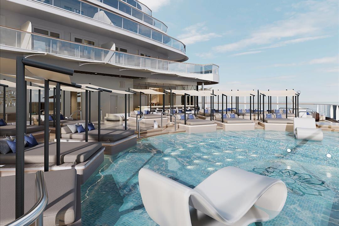 Luxury cruise ship pool deck with mosaic pool, white loungers and shaded cabanas