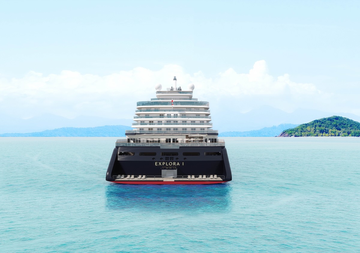 Rear view of cruise ship Explora I centered on turquoise sea with distant islands