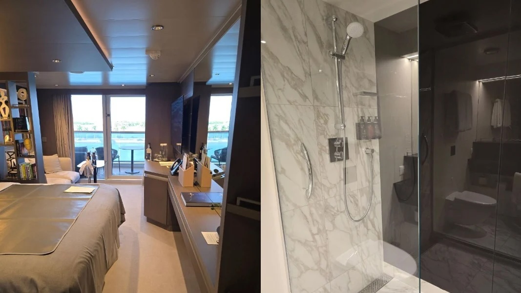 Cruise stateroom with bed, desk and balcony view, with en suite marble tiled glass shower