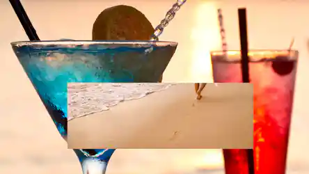 Blue margarita with lime and red cocktail at sunset, overlaid by beach footprints and shoreline
