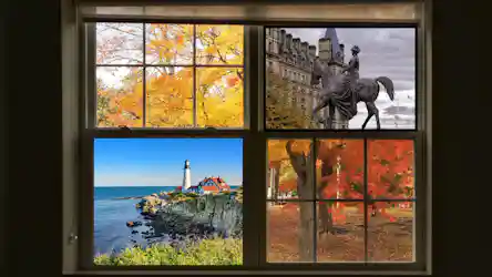 Four-pane window view: yellow and red fall trees, equestrian statue, rocky lighthouse