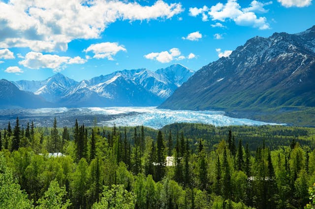 Alaska glacier with snowy mountain in background