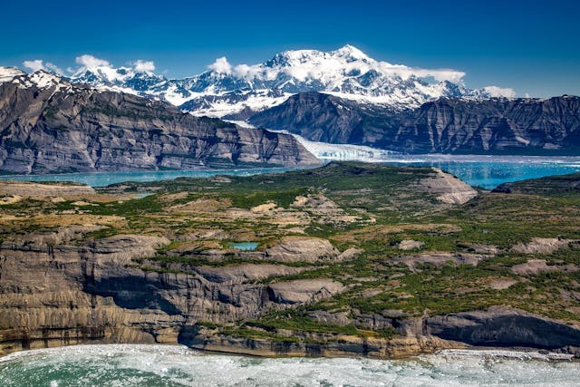 Alaska glacier with snowy mountain in background